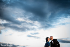 Beautiful Indian wedding couple kissing outside outdoor photography,indian groom suit,indian bride lengha