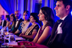 Indian bride and groom with family at wedding reception indian wedding reception,lightning,indian wedding reception decor