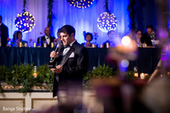 Indian groomsman giving a speech indian wedding reception,indian wedding reception decor,lightning