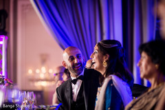 Indian bride and groom laughing during wedding reception indian wedding reception,indian groom suit,lightning
