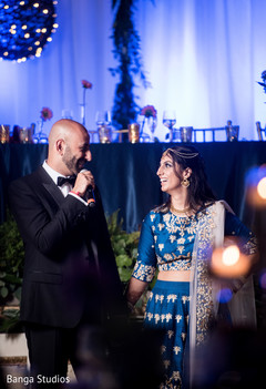 Indian bride and groom giving a speech indian groom suit,indian bride lengha,indian wedding reception