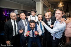 Indian groom with wedding reception guests indian wedding reception,indian groom suit