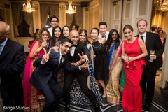 Indian bride and groom with wedding reception guests indian wedding reception,indian groom suit,indian bride fashion