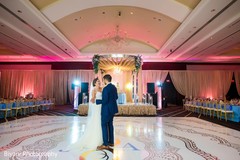Indian bride and groom first dance indian bride reception fashion,indian groom suit,indian wedding reception,monogramed dance floor.