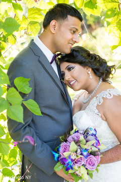 Magical outdoor Indian wedding photo. indian groom,indian bride,bridal bouquet,indian wedding photography