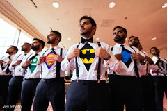 Indian groom with groomsmen wearing superhero t-shirts under their shirts Indian groom with groomsmen wearing superhero t-shirts under their shirts