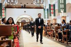 Indian groom with groomsmen making their entrance on wedding ceremony Indian groom with groomsmen making their entrance on wedding ceremony