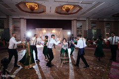 Indian bridesmaids dancing with groomsmen indian wedding reception photography,indian groomsmen fashion,indian bridesmaids’ fashion