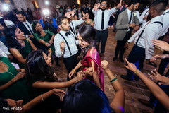 Indian bride and groom dancing with guests dj and entertainment,indian wedding reception,indian wedding reception photography