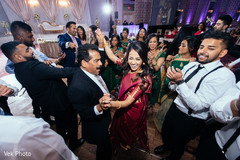 Indian bride dancing with guests dj and entertainment,lightning,indian wedding reception,indian wedding reception photography