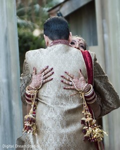 Indian bride and groom hugging each other Indian bride and groom hugging each other