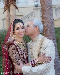 Indian bride being kissed on her cheek Indian bride being kissed on her cheek