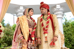 Enchanting indian bride and groom looking at each other indian bride fashion,indian groom sherwani,bridal jewelry,indian wedding ceremony