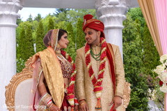 Sweet indian bride and groom on their wedding ceremony indian wedding ceremony,indian groom sherwani,indian bride lengha,bridal jewelry