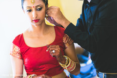 Gorgeous indian bride getting ready for wedding ceremony