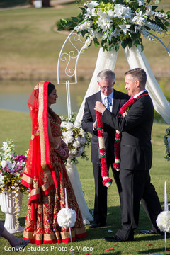 Traditional indian garland exchange ritual. indian bride,indian groom,indian fusion wedding ceremony,floral and decor,jaimala