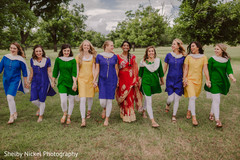 Indian bride and bridesmaids walking holding hands Indian bride and bridesmaids walking holding hands