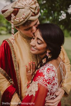 Indian groom kissing bride Indian groom kissing bride