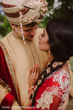 Indian bride and groom looking at each other Indian bride and groom looking at each other