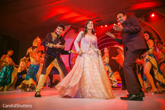 Indian bride and groom dancing during sangeet night Indian bride and groom dancing during sangeet night