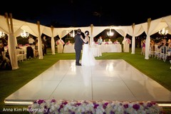 Indian bride and groom having their first dance indian groom suit,indian bride reception fashion,indian wedding reception,dj and entertainment