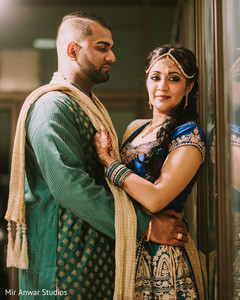 Indian bride and groom posing for photo shoot Indian bride and groom posing for photo shoot