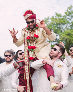 Indian groom being lifted up by groomsmen indian groom fashion,indian groomsmen fashion,milni ceremony