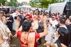 Indian bride dancing with groom bridal jewelry,indian bride fashion,indian groom turban,milni ceremony