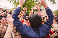 Indian bride with guests celebrating milni indian wedding ceremony,indian bride fashion,milni ceremony