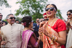 Indian bride during milni celebration milni ceremony,indian bride fashion,bridal jewelry