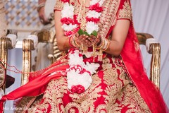 Indian Bride with mehndi heena hands holding betel leaf bridal jewelry,maharani's bridal bangles.mehndi art,indian wedding ceremony