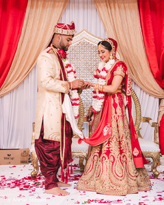 Indian groom putting ring on bride's finger indian bride fashion,indian groom fashion,indian wedding ceremony