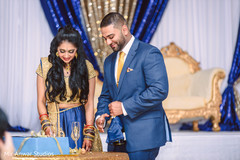 Charming indian bride and groom at wedding reception indian groom suit,indian bride reception fashion,maharani's bridal bangles,indian wedding reception