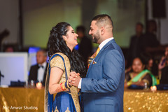 Indian bride and groom having their first dance indian groom suit,indian bride fashion,indian wedding reception,dj and entertainment