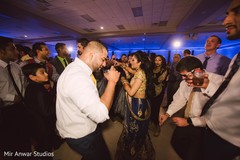 Indian bride and groom dancing during their wedding reception indian wedding reception,indian wedding reception photography,indian groom,indian bride