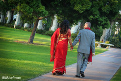 Indian newlyweds walking at the venue indian couple,indian bride,indian groom