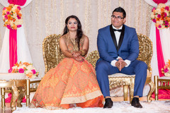 Indian bride and groom at their wedding soiree. indian bride and groom,indian wedding reception,reception fashion