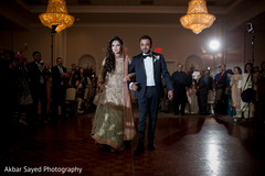Indian bride and groom making their entrance to wedding reception indian wedding reception,indian groom suit,indian bride fashion