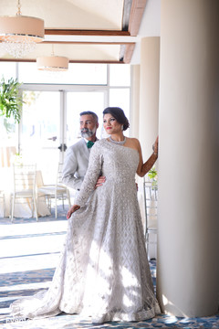 Indian couple in Silver gray wedding reception outfits. Indian couple in Silver gray wedding reception outfits.
