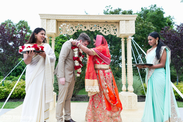 Traditional garland exchange ritual.