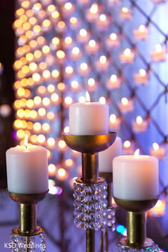 Elegant candle holders. indian wedding reception,floral and decor,lightning