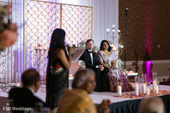 Indian newlyweds listening attentively indian wedding,indian couple