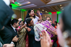 Guests carrying indian bride in the dance floor indian bride,bridal lengha,indian wedding reception