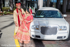 Indian bride and groom posing with wedding car indian groom fashion,indian bride fashion,indian wedding transportation