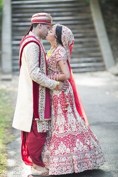 Sweet indian bride and groom kissing indian groom fashion,indian groom sherwani,indian bride lengha,bridal jewelry