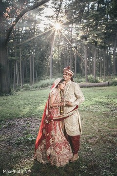 Astonishing indian bride and groom posing for photo shoot indian groom sherwani,indian bride lengha,outdoor photography