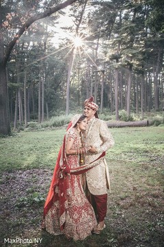 Indian bride and groom hugging each other indian groom sherwani,indian bride lengha,outdoor photography
