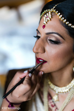 Indian bride being dolled up Indian bride being dolled up