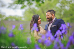 Indian Wedding picture in a flower field. indian bride and groom,reception fashion,indian wedding photography
