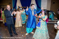 Indian bride and groom dancing Indian bride and groom dancing